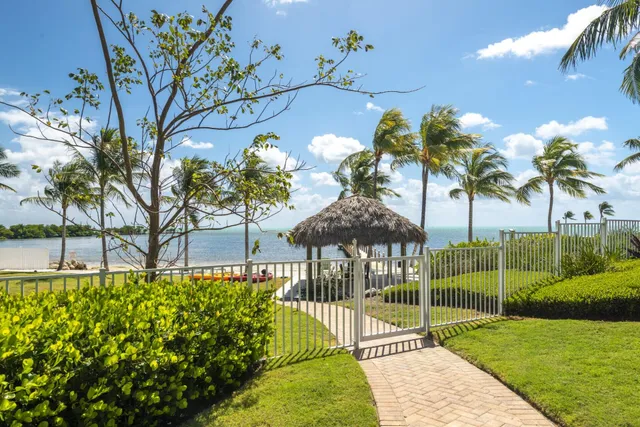 a view of a balcony with chair and wooden floor