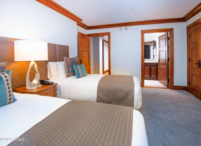 a bedroom with bed and window