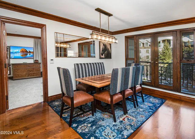a view of a livingroom with furniture wooden floor and windows