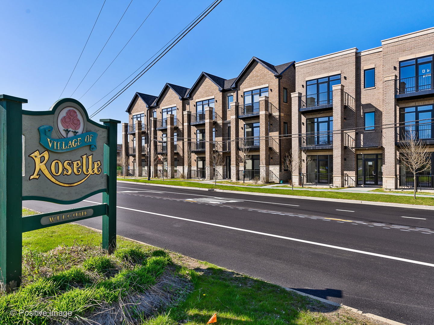 a view of a street with apartment building