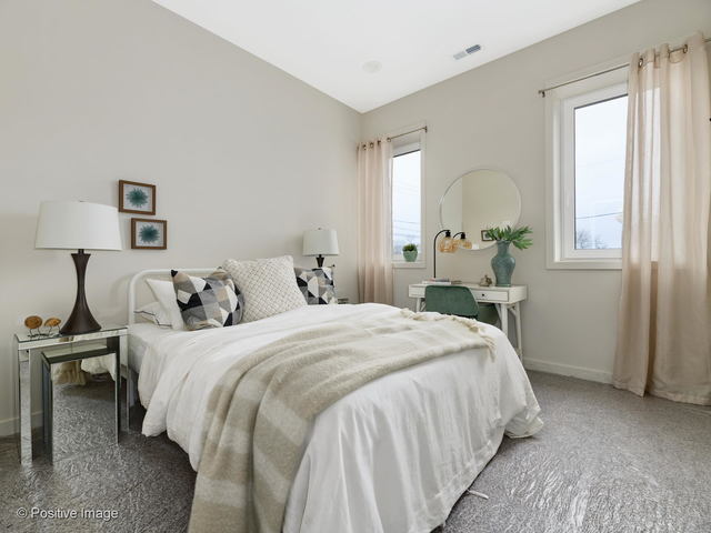 770 East Irving Park Road, Unit 3E Roselle, IL 60172 - Photo 14 of 17 a bedroom with a bed and a window