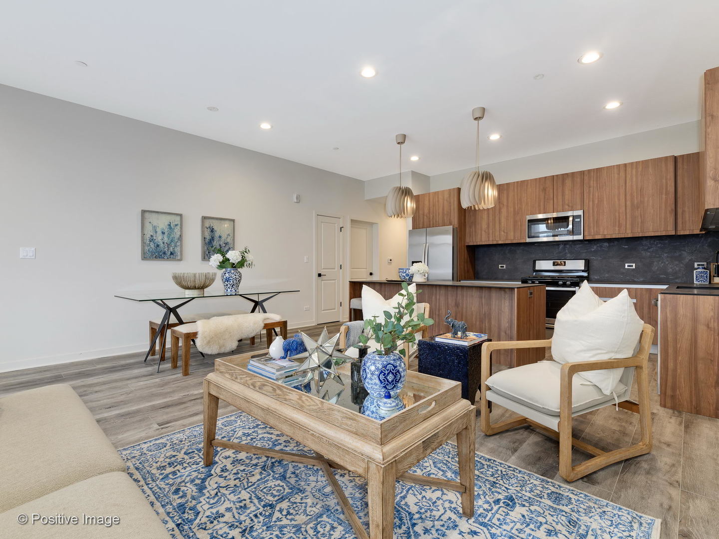 770 East Irving Park Road, Unit 3E Roselle, IL 60172 - Photo 5 of 17 a living room with furniture and kitchen view