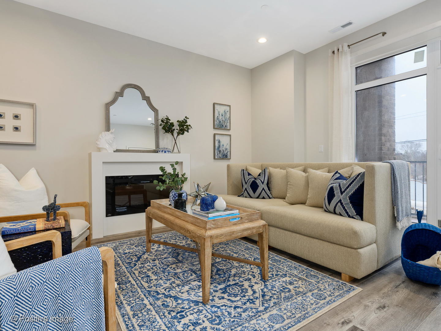 770 East Irving Park Road, Unit 3E Roselle, IL 60172 - Photo 7 of 17 a living room with furniture and a fireplace