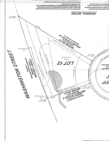 a view of a swimming pool with a yard