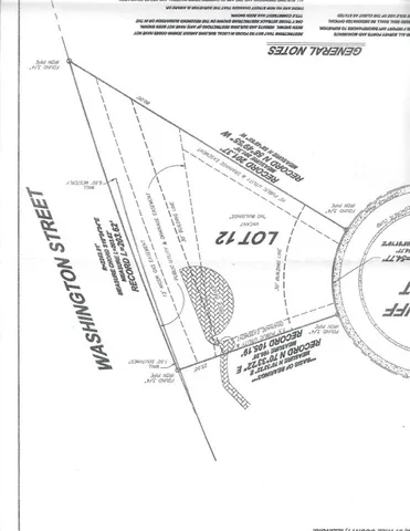 a view of a swimming pool with a yard