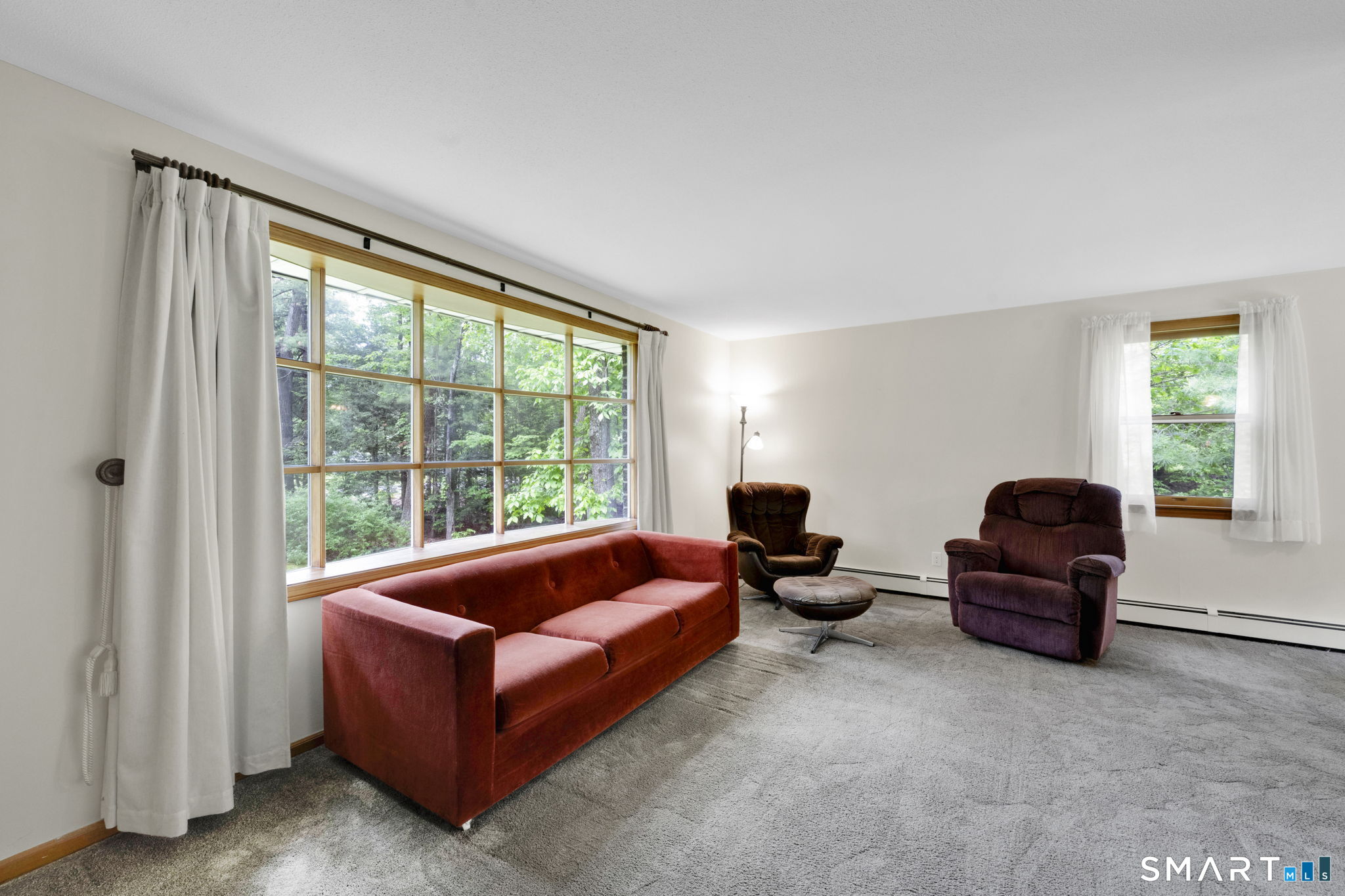 158 Notch Road Granby, CT 06035 - Photo 15 of 40 a living room with furniture and a large window