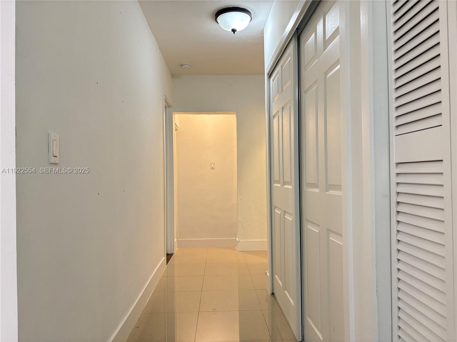 527 Southwest 9th Avenue, Unit 527 Miami, FL 33130 - Photo 17 of 34 a bathroom with a glass shower door