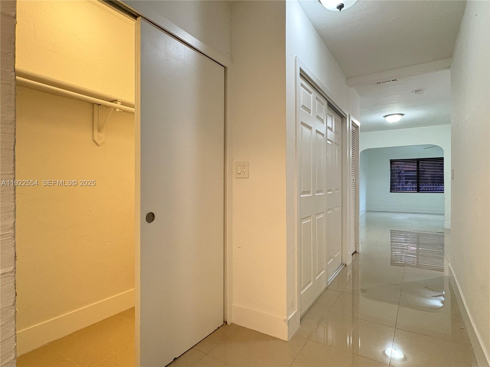 527 Southwest 9th Avenue, Unit 527 Miami, FL 33130 - Photo 18 of 34 a bathroom with a mirror and a shower