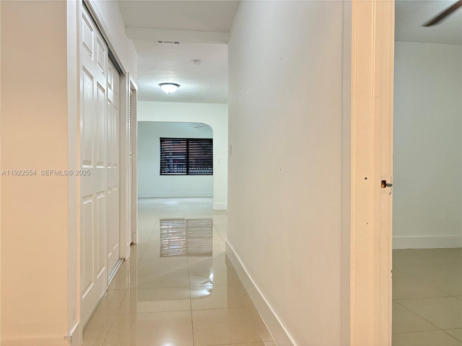 527 Southwest 9th Avenue, Unit 527 Miami, FL 33130 - Photo 19 of 34 a view of a hallway with wooden floor