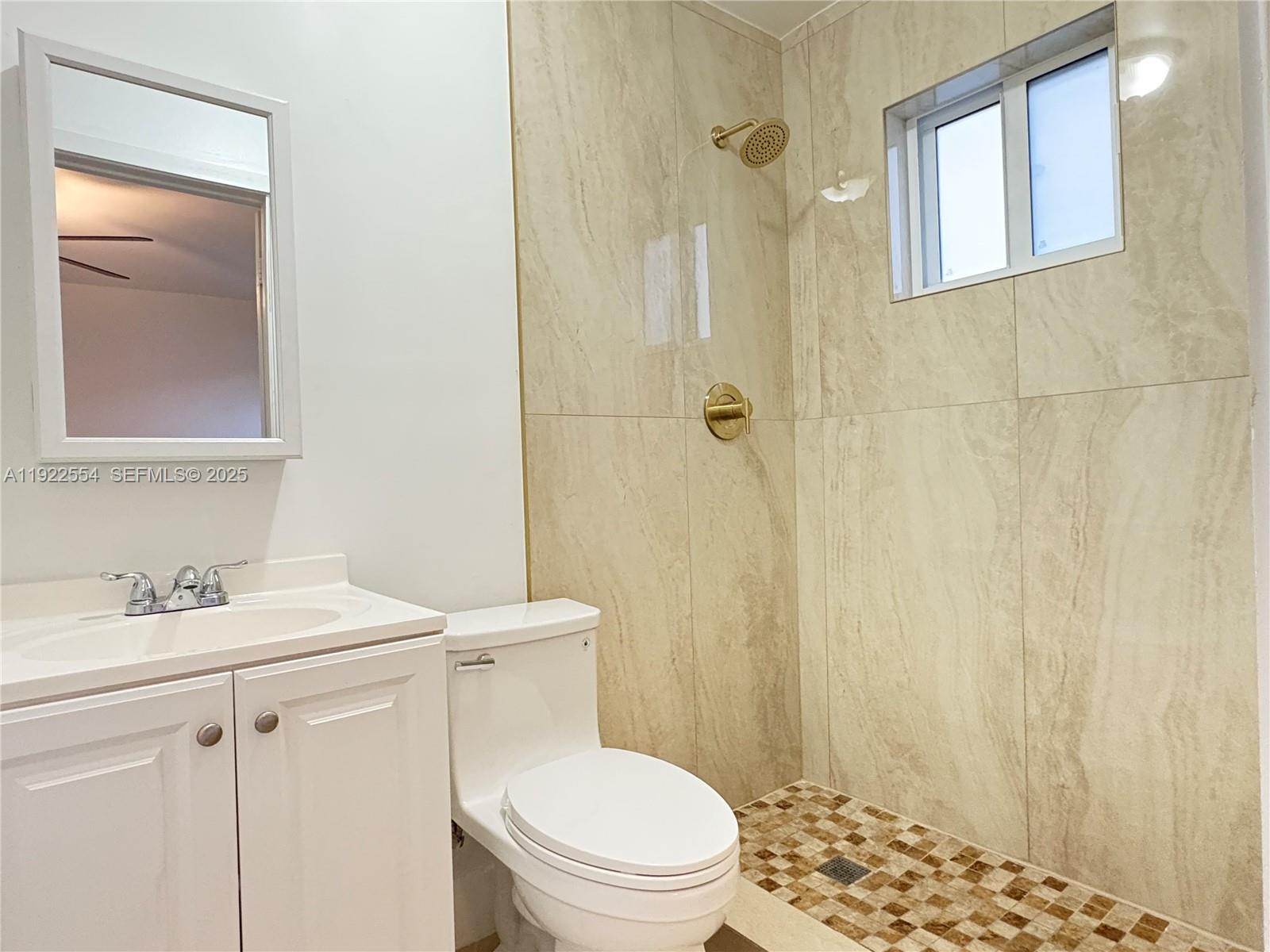 527 Southwest 9th Avenue, Unit 527 Miami, FL 33130 - Photo 23 of 34 a bathroom with a sink a toilet and shower