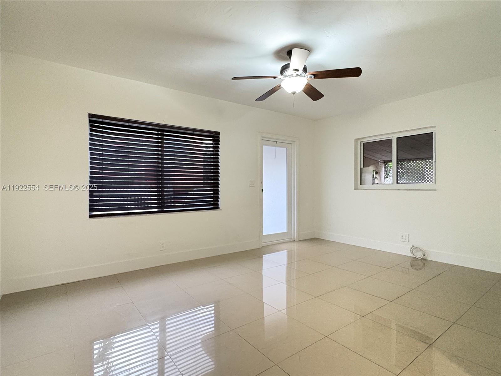 527 Southwest 9th Avenue, Unit 527 Miami, FL 33130 - Photo 5 of 34 a view of an empty room with a window
