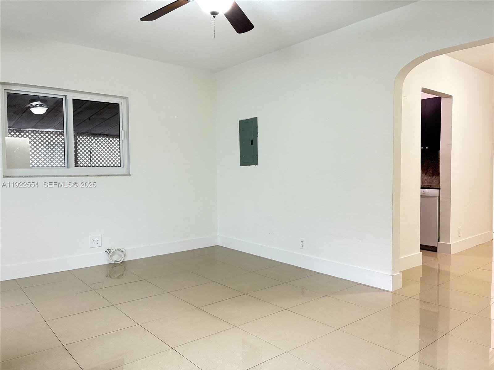 527 Southwest 9th Avenue, Unit 527 Miami, FL 33130 - Photo 6 of 34 an empty room with a empty space and windows