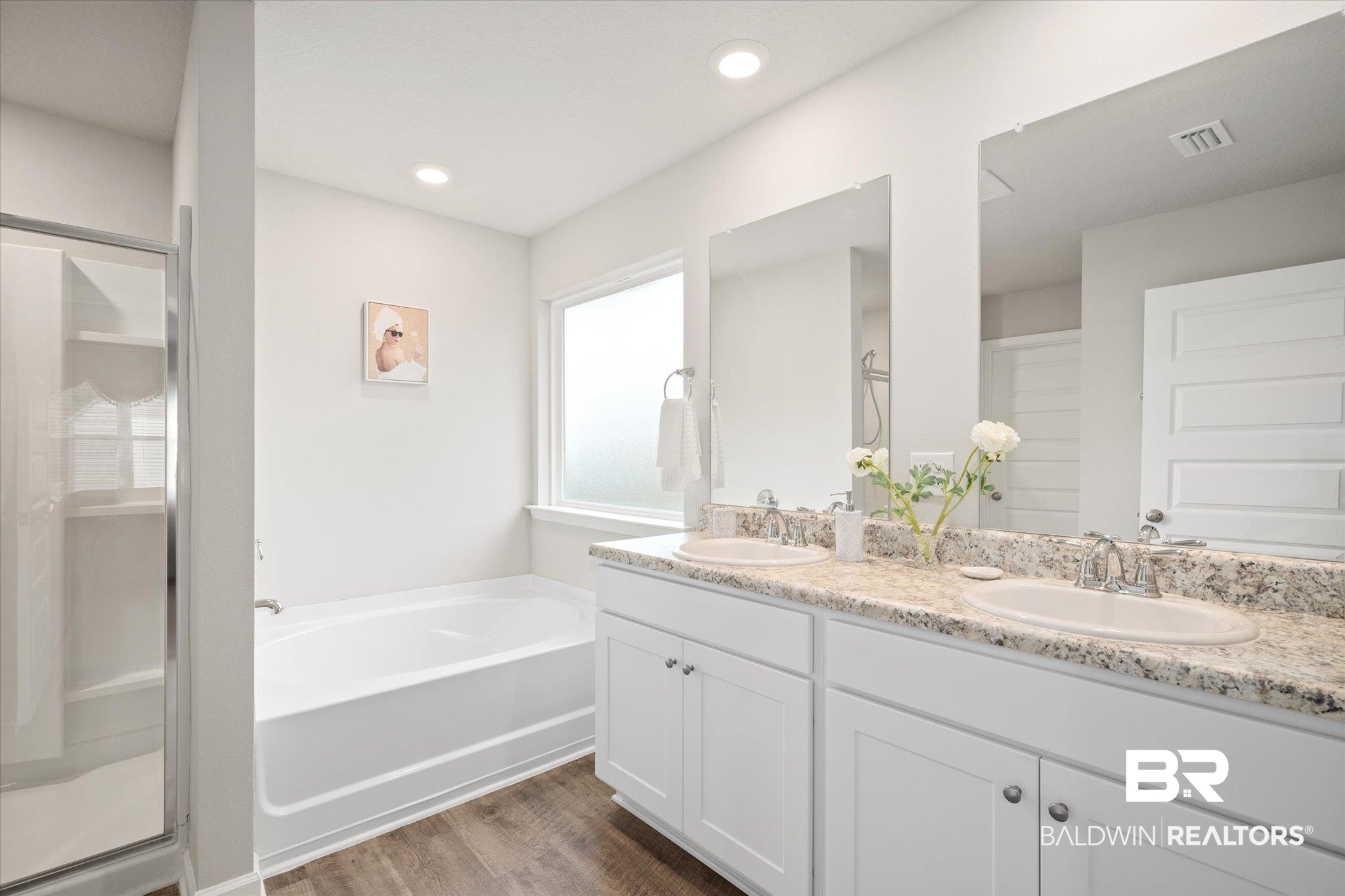 446 Paget Drive East Mobile, AL 36608 - Photo 11 of 20 Bathroom featuring vanity, wood-type flooring, and shower with separate bathtub