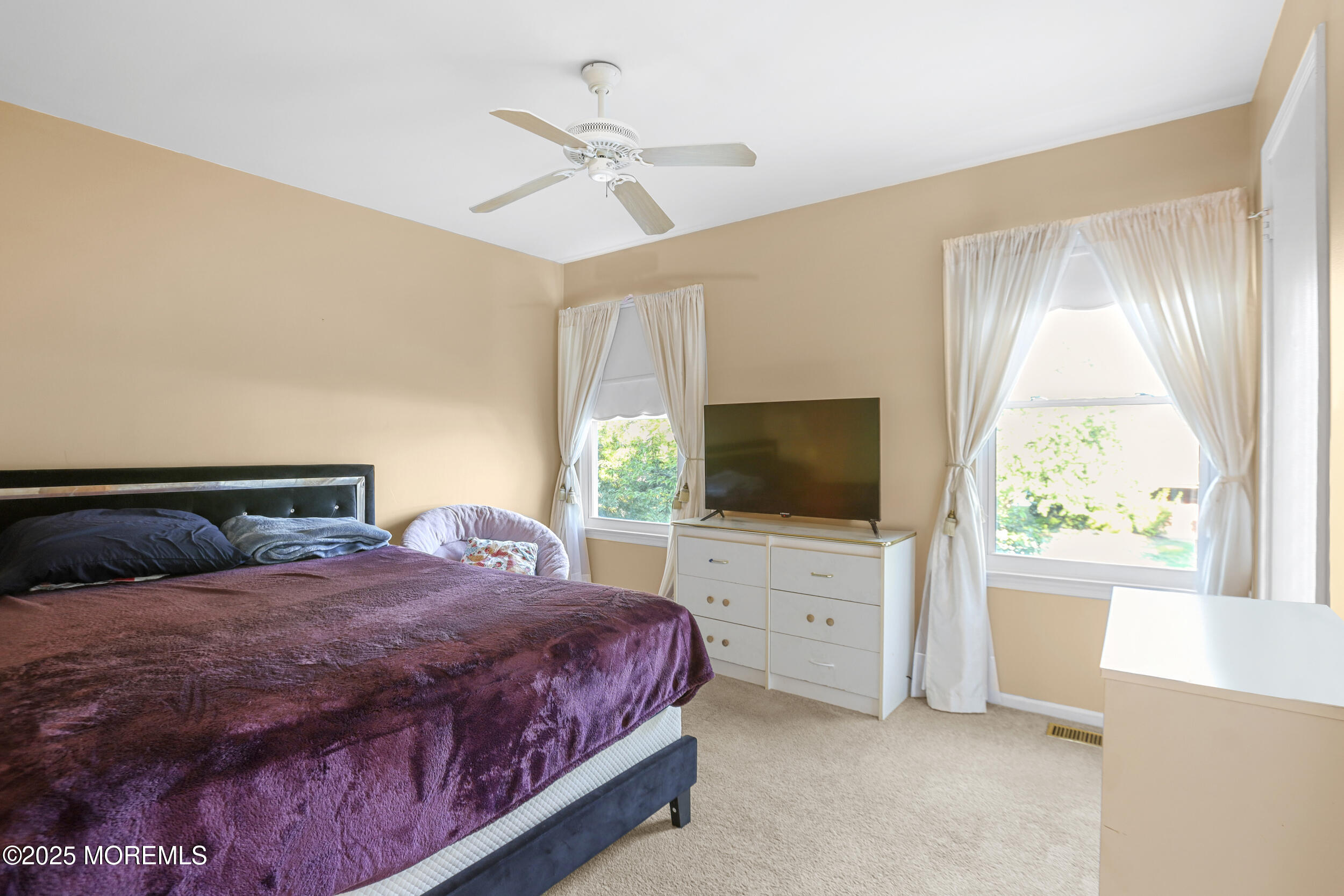 35 Winsted Drive Howell, NJ 07731 - Photo 17 of 22 a bedroom with a bed and a flat screen tv