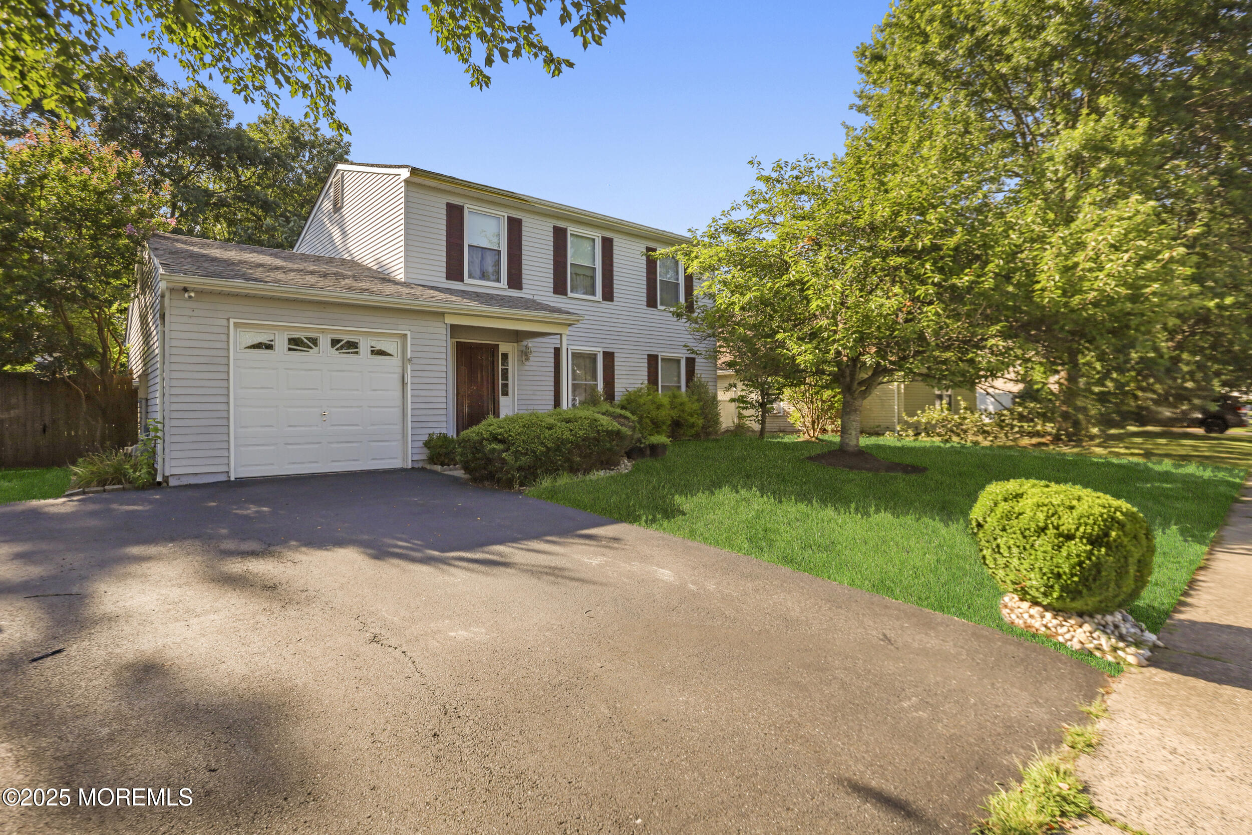 35 Winsted Drive Howell, NJ 07731 - Photo 2 of 22 a front view of a house with a yard