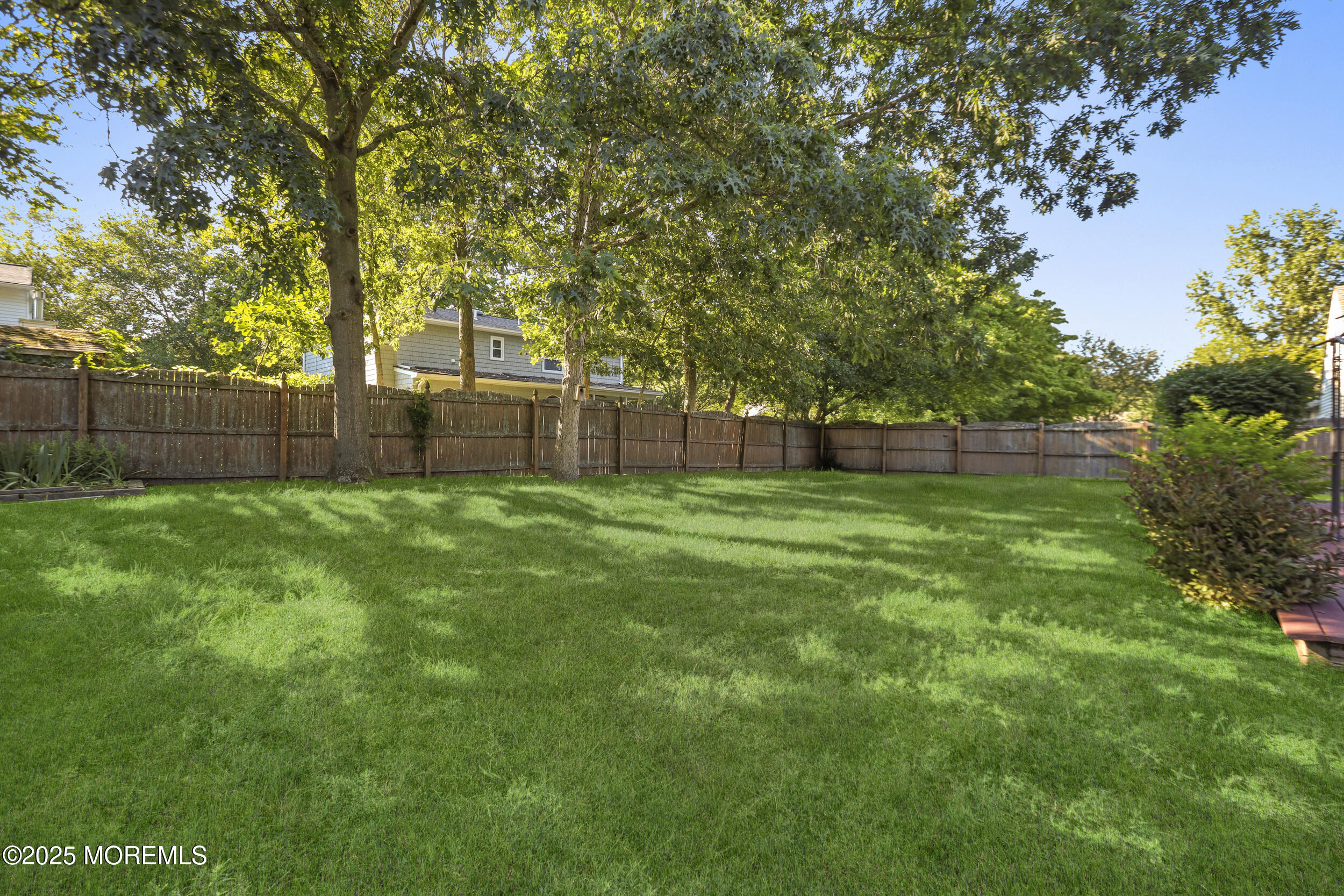 35 Winsted Drive Howell, NJ 07731 - Photo 22 of 22 a view of a backyard with a large tree