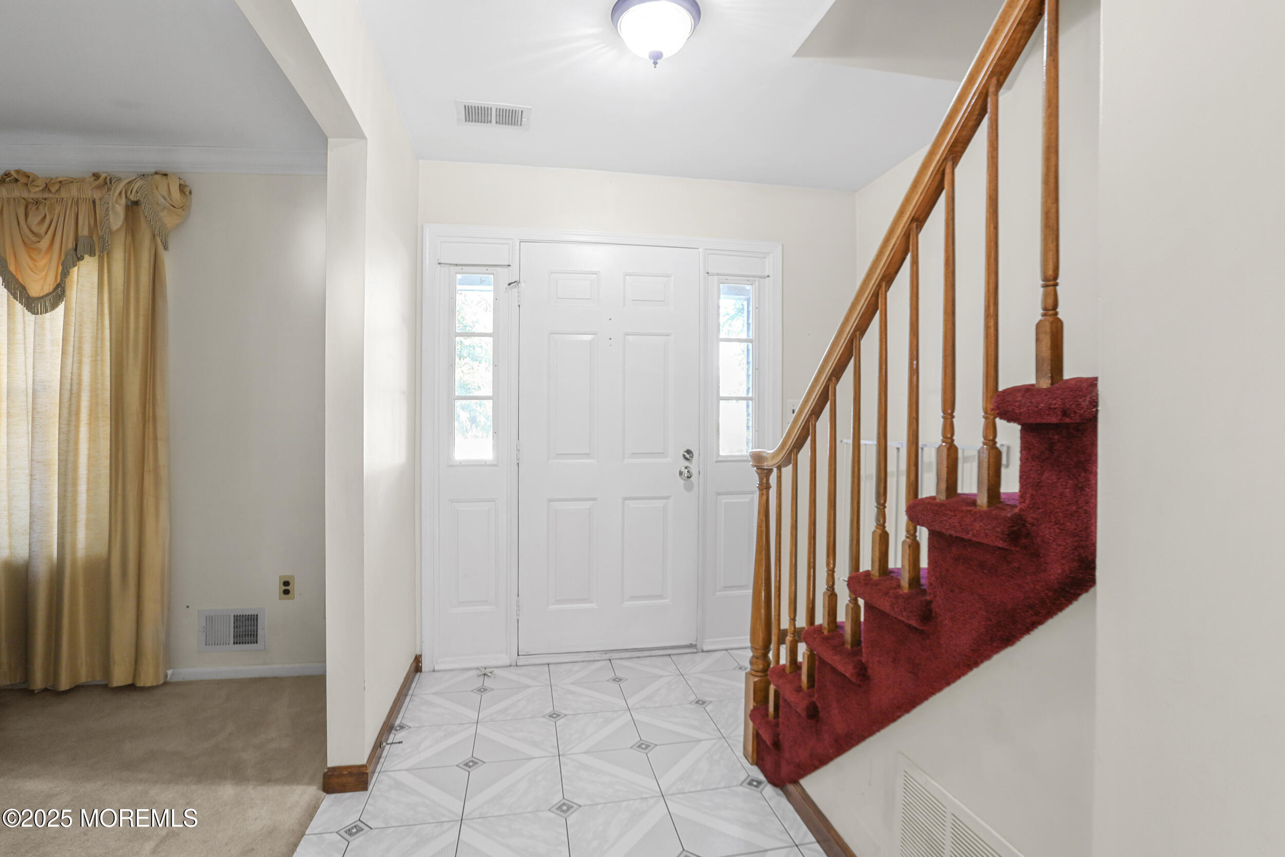 35 Winsted Drive Howell, NJ 07731 - Photo 3 of 22 a view of an entryway with staircase
