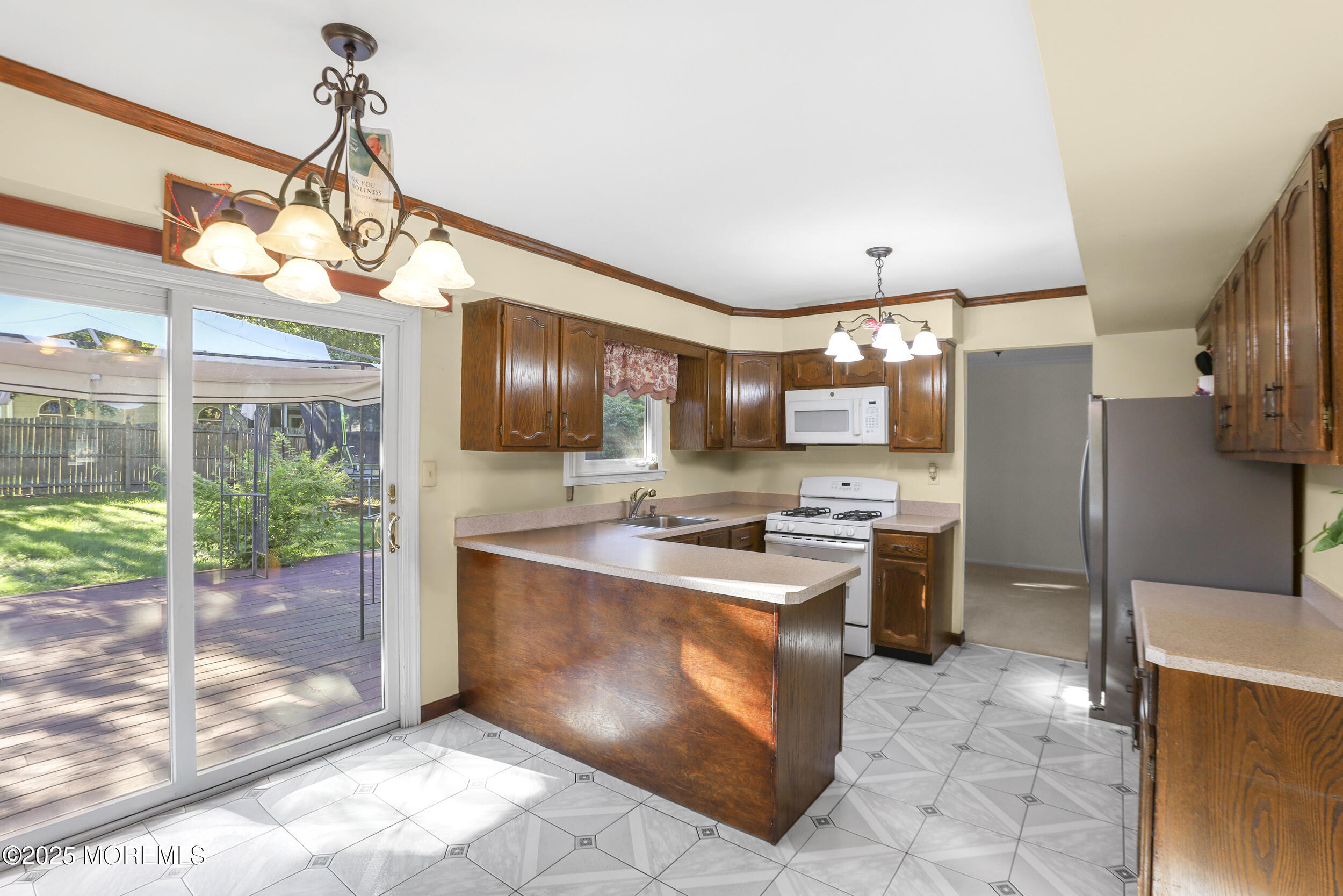 35 Winsted Drive Howell, NJ 07731 - Photo 9 of 22 a kitchen with stainless steel appliances a sink a counter top space cabinets and wooden floor