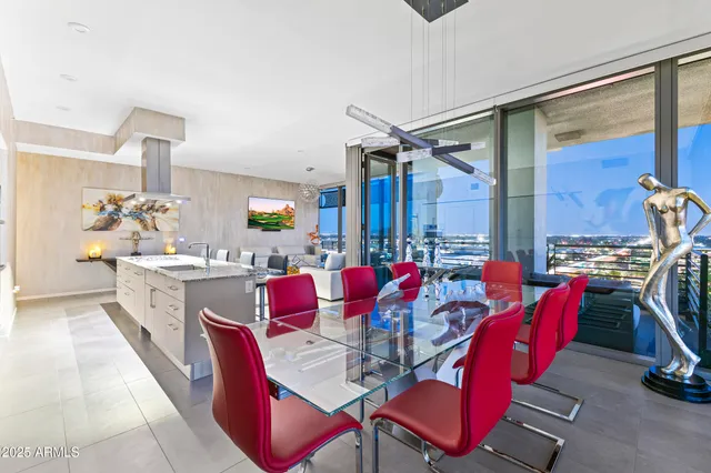 a large white kitchen with a large window