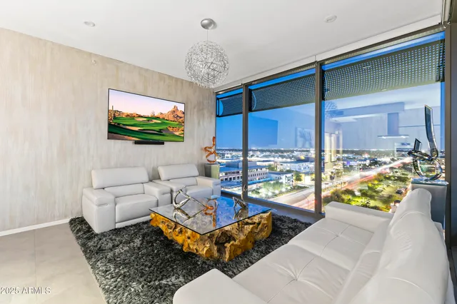 a bed room with a bed and a chair