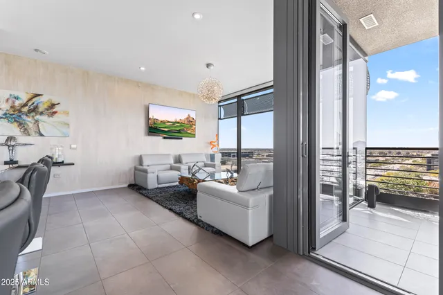 a bedroom with a bed and glass door