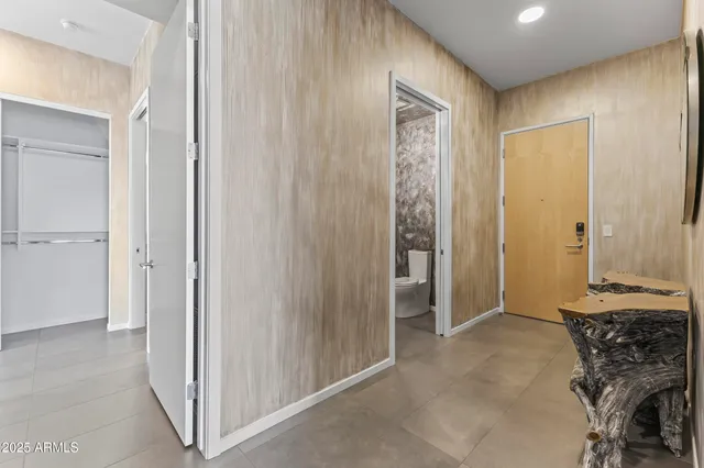 a white toilet sitting next to a shower curtain