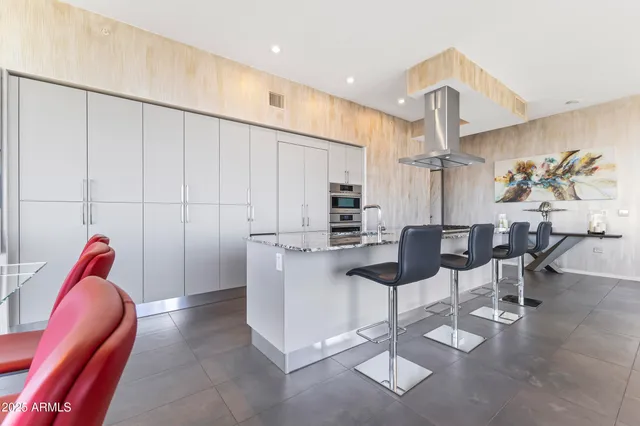 a view of a hallway with furniture and a livingroom view