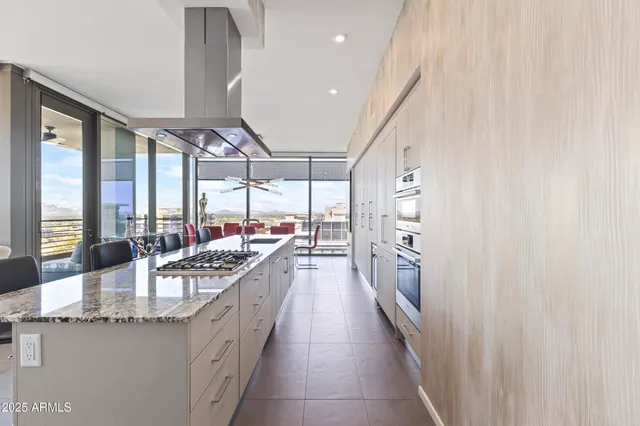 a bedroom with a bed and a tv on the dresser