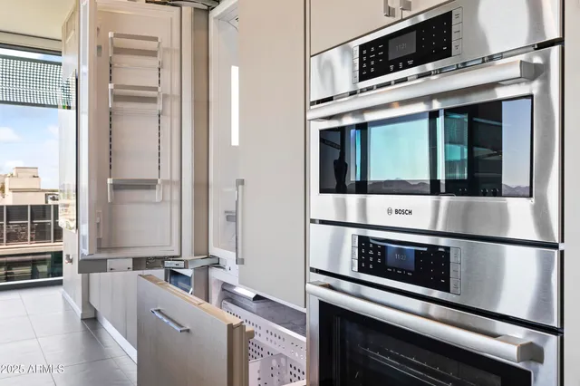 a bathroom with a granite countertop shower sink vanity and toilet