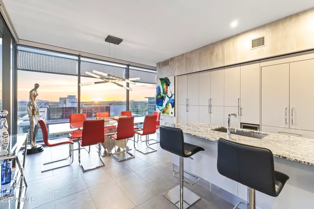 a living room with lots of furniture and a table