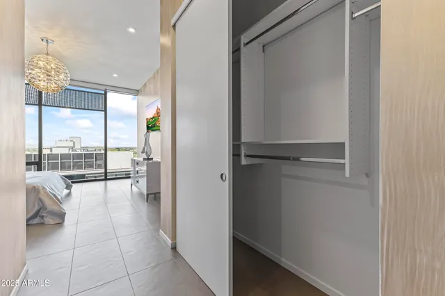 a living room with fireplace furniture and a large window