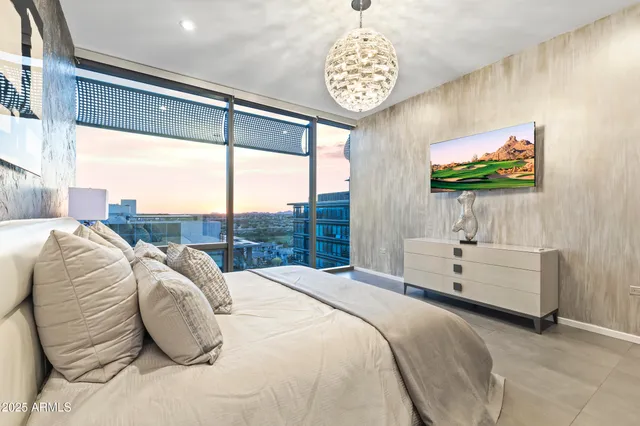 a living room with furniture a rug and a large window