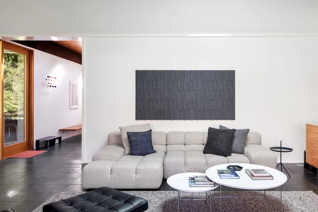 a living room with furniture and a table