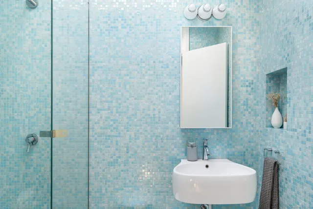 a bathroom with a sink and mirror