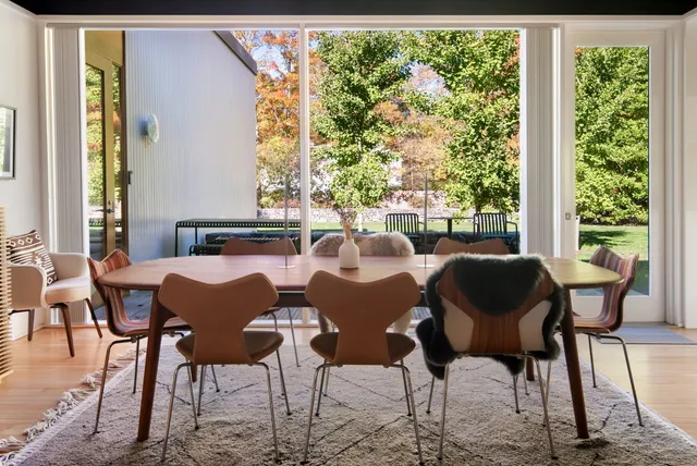 a view of a dining room with furniture window and outside view