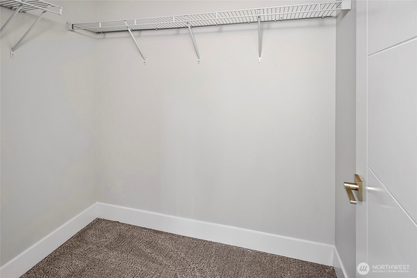 21402 39th Drive Southeast, Unit A Bothell, WA 98021 - Photo 24 of 31 a view of a room with racks on the wall