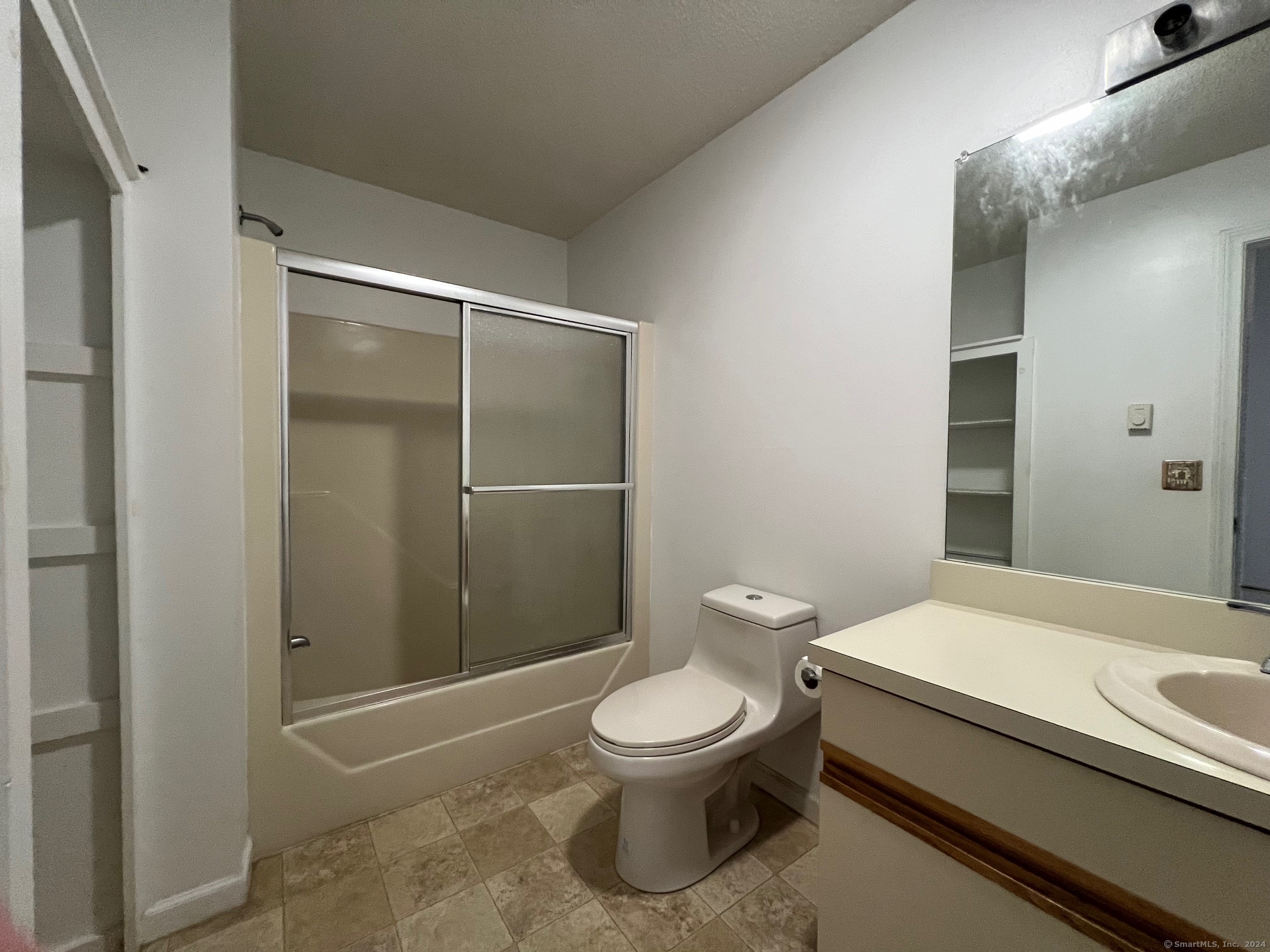 35 Ruth Street, Unit 66 Bristol, CT 06010 - Photo 11 of 17 a bathroom with a toilet a sink and shower