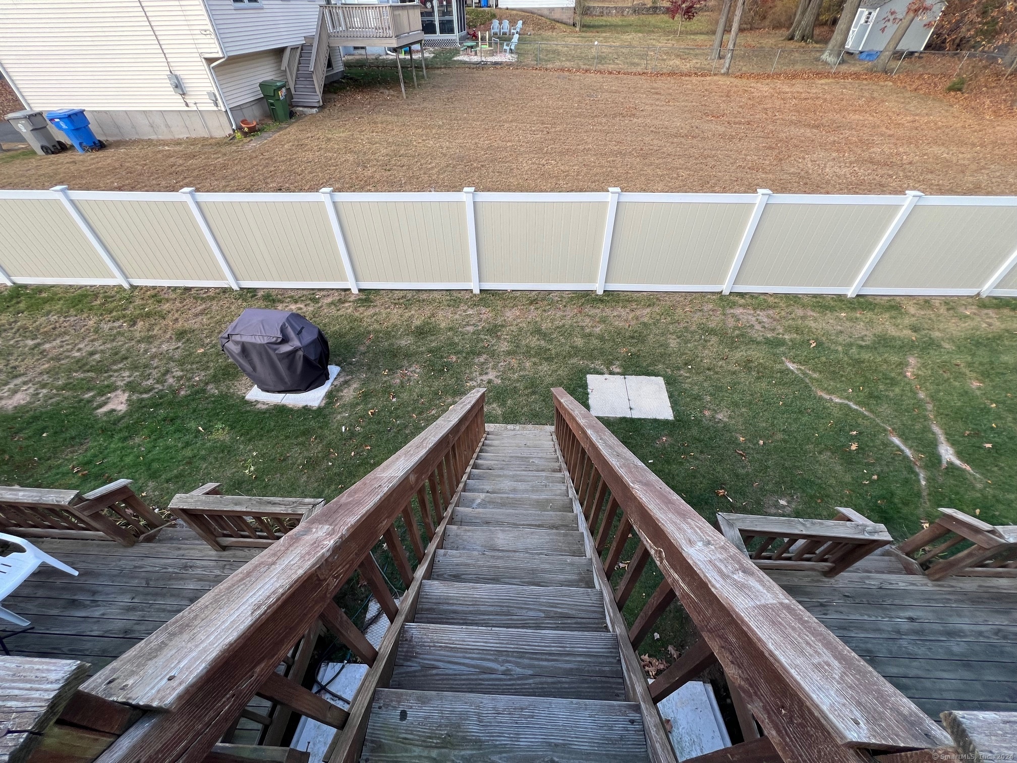 35 Ruth Street, Unit 66 Bristol, CT 06010 - Photo 16 of 17 a view of a balcony with two chairs and a potted plant