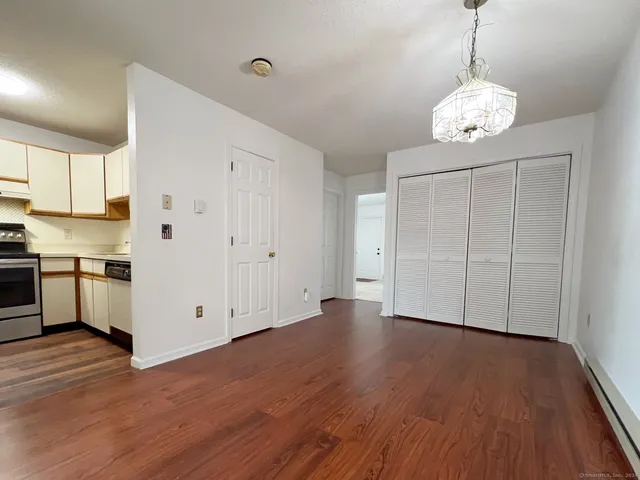 a kitchen with stainless steel appliances granite countertop a stove a refrigerator and a sink