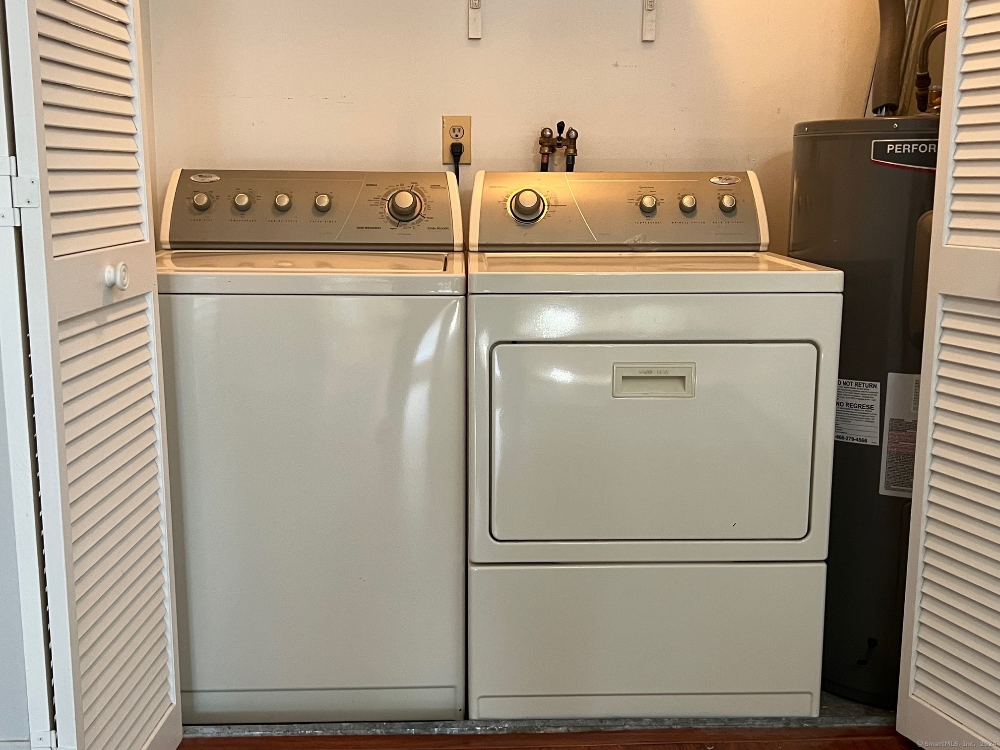 35 Ruth Street, Unit 66 Bristol, CT 06010 - Photo 8 of 17 a utility room with dryer and washer