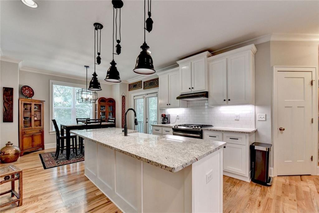 919 Fields Chapel Road Canton, GA 30114 - Photo 11 of 58 a kitchen with granite countertop a sink a counter top space appliances and cabinets