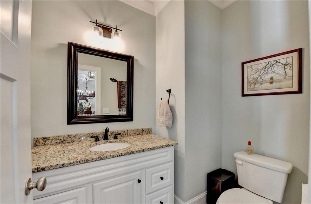 919 Fields Chapel Road Canton, GA 30114 - Photo 22 of 58 a bathroom with a toilet sink and mirror