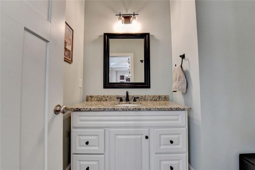 919 Fields Chapel Road Canton, GA 30114 - Photo 23 of 58 a bathroom with a sink and a mirror