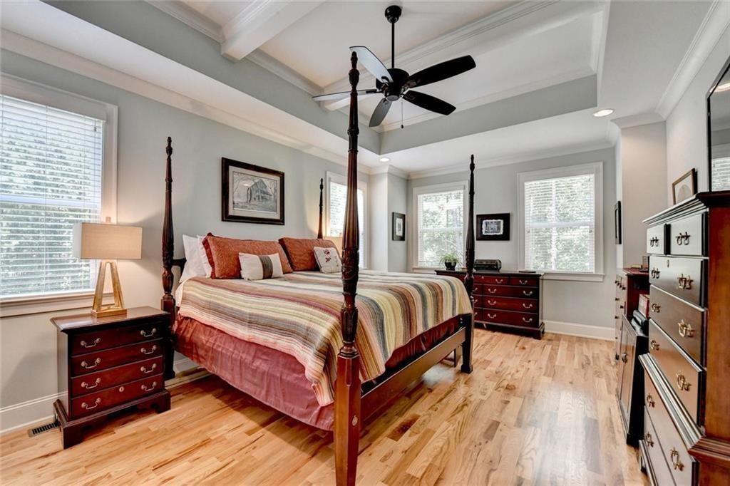 919 Fields Chapel Road Canton, GA 30114 - Photo 24 of 58 a spacious bedroom with a bed and a dresser