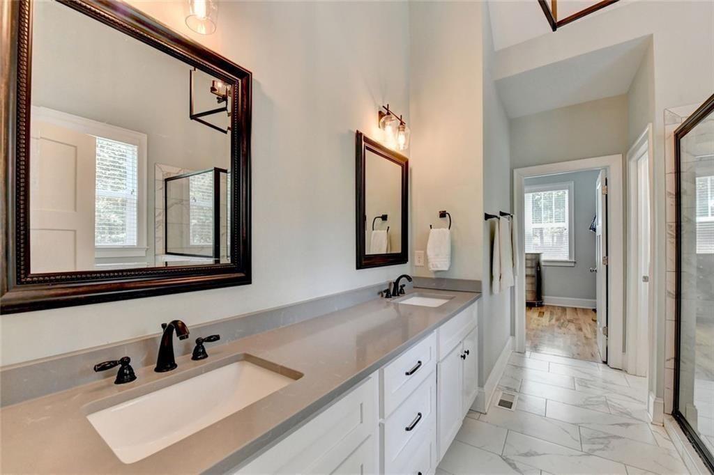 919 Fields Chapel Road Canton, GA 30114 - Photo 26 of 58 a bathroom with a sink and a mirror