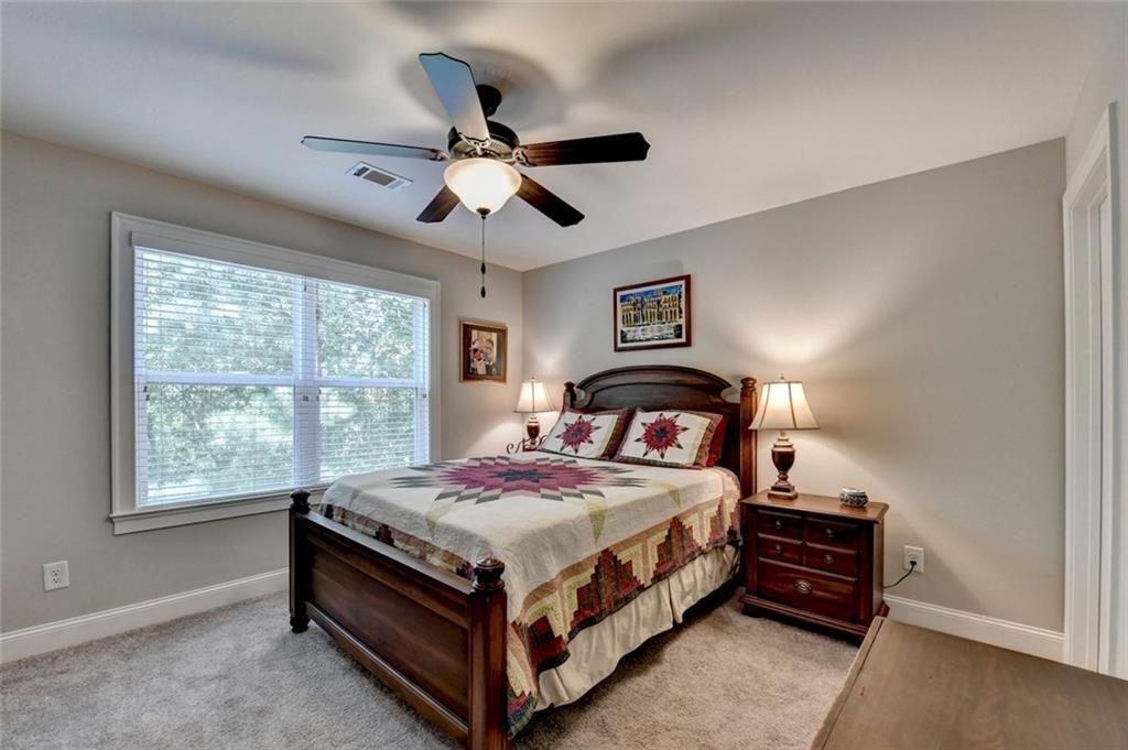 919 Fields Chapel Road Canton, GA 30114 - Photo 33 of 58 a bedroom with a bed and a window