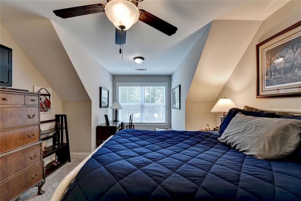 919 Fields Chapel Road Canton, GA 30114 - Photo 39 of 58 a bedroom with a large bed and a window