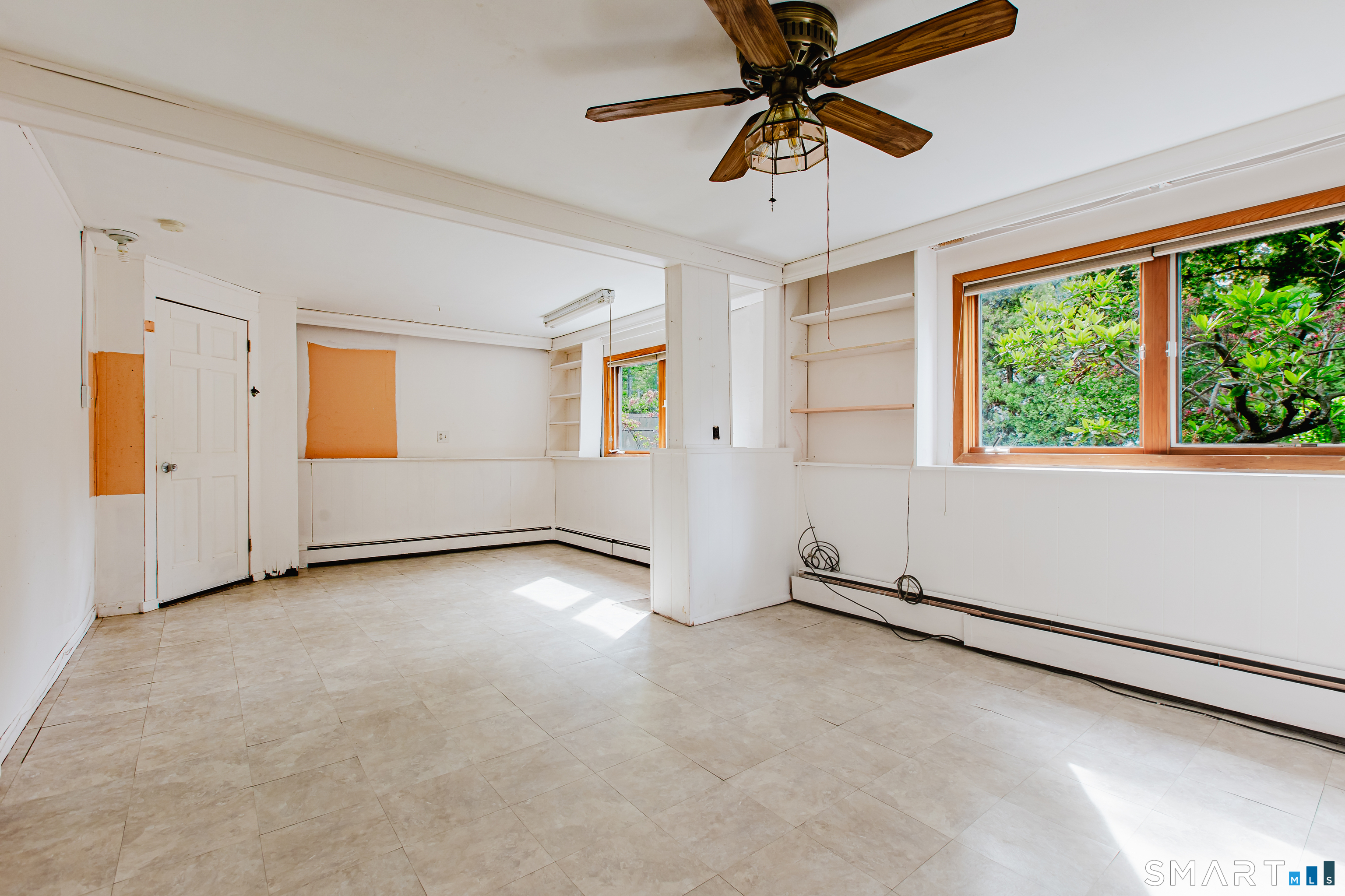 75 Westwood Road Stamford, CT 06902 - Photo 23 of 40 Large Family Room features 4 windows & ceiling fan