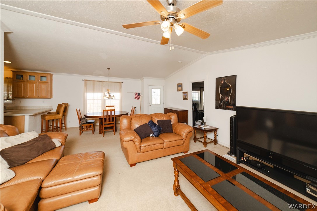 3190 East Pepper Tree Road Kingman, AZ 86409 - Photo 5 of 67 a living room with furniture and a flat screen tv