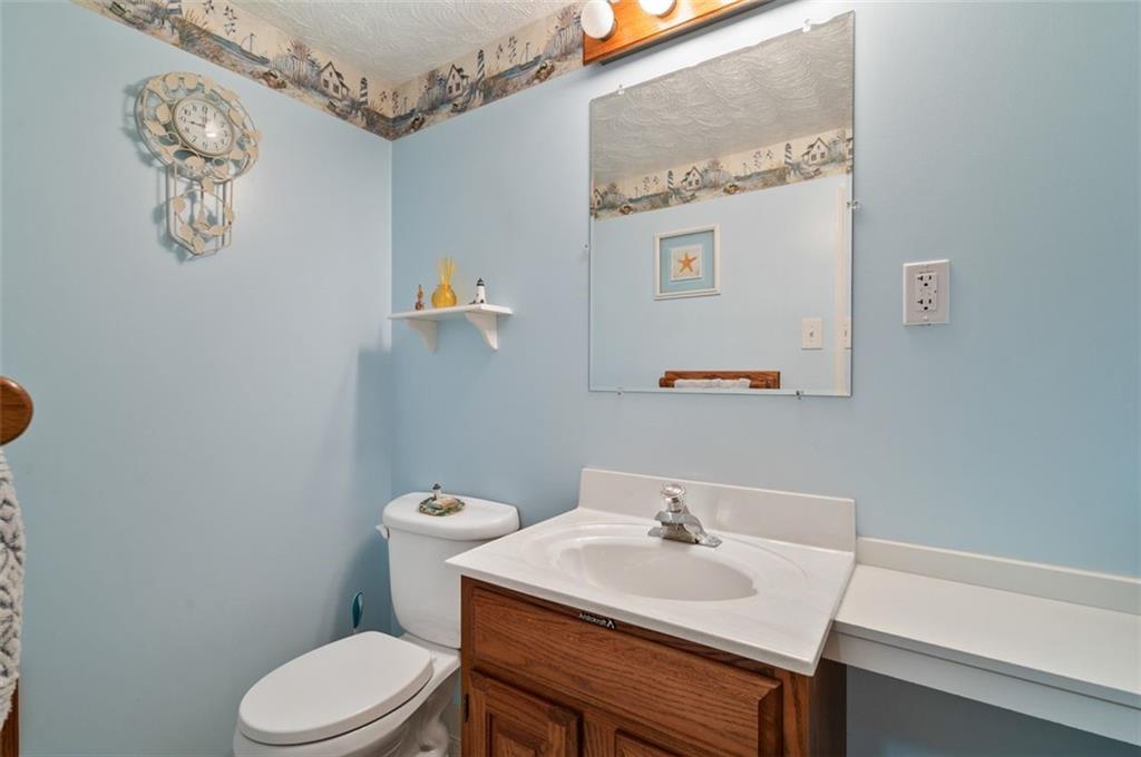 172 Eileen Drive Pittsburgh, PA 15227 - Photo 12 of 21 a bathroom with a sink mirror and toilet